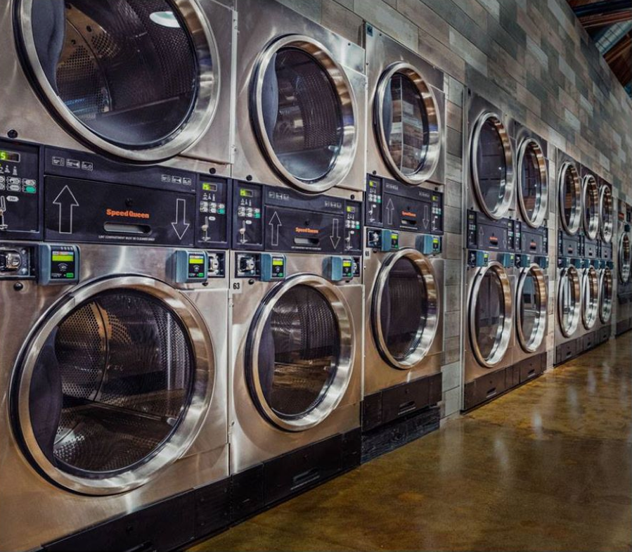 Modern-laundry-room-with-Speed-Queen-commercial-laundry-equipment.png
